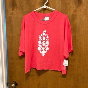 414. Free People Coral Pink Graphic Cropped Tee with White Center Motif